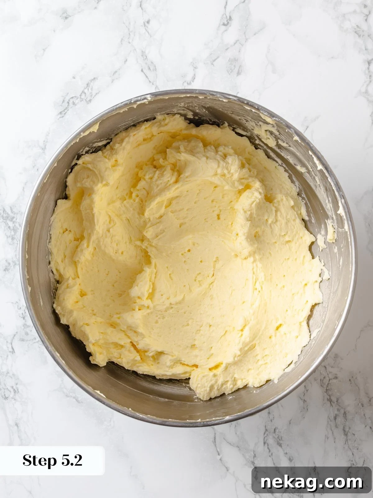 Silken Lemon Meringue Frosting 12 Finished lemon Swiss meringue buttercream, light, fluffy, and vibrant, ready for frosting.