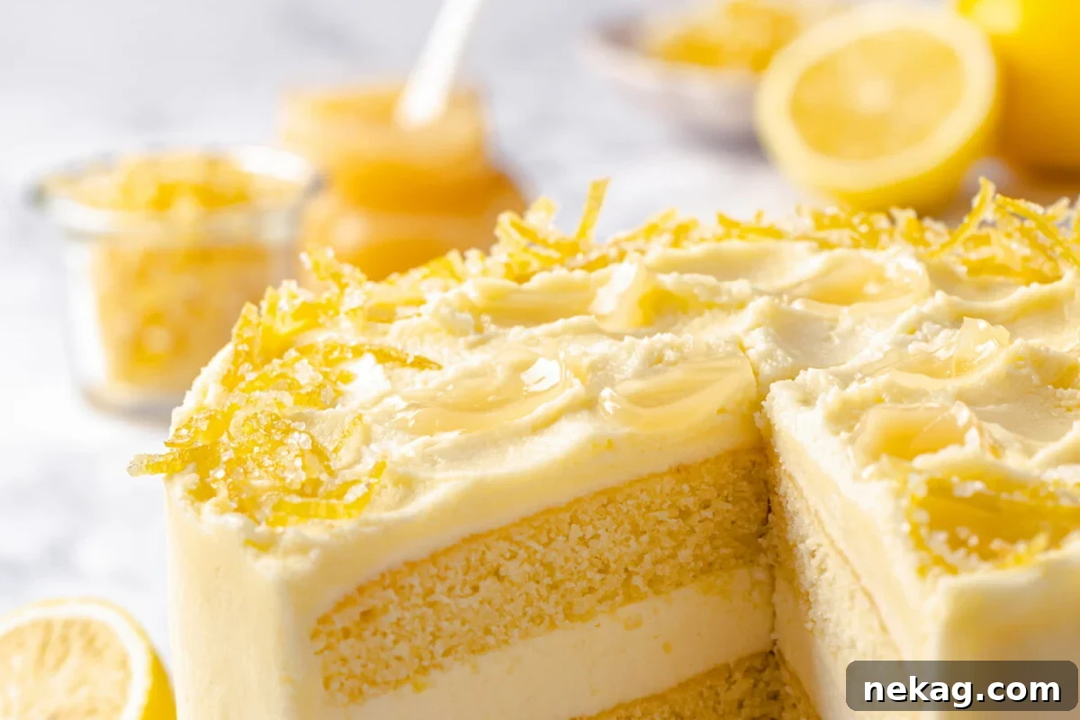 Silken Lemon Meringue Frosting 5 Beautifully decorated lemon cake sliced open to reveal delicate layers filled generously with smooth lemon Swiss meringue buttercream.