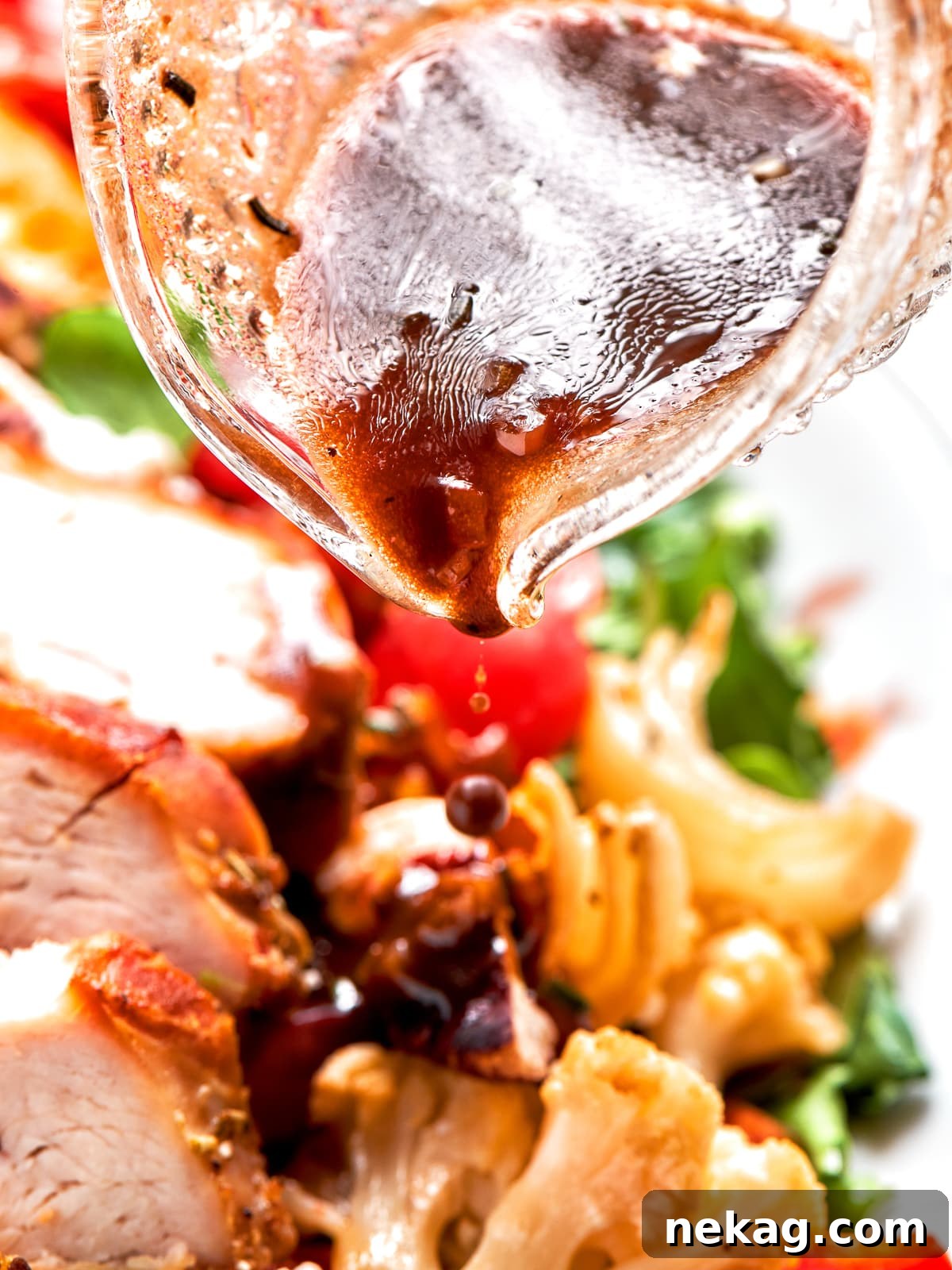 Lemon balsamic vinaigrette poured over mixed greens and chicken.