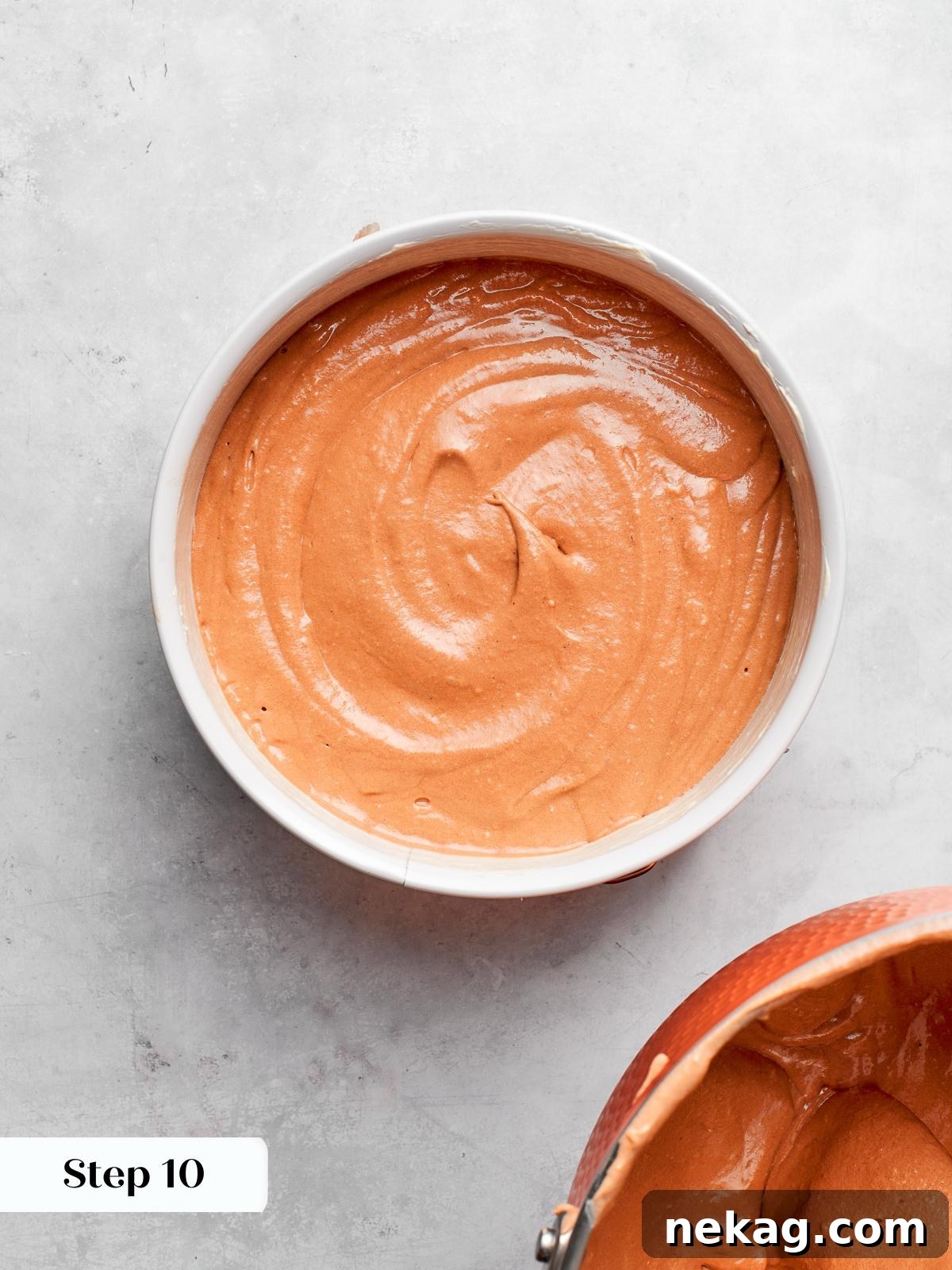German chocolate cake batter poured evenly into prepared baking pan.