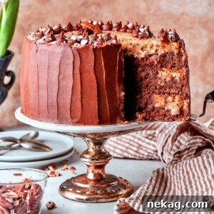 Cake server lifting slice of German chocolate cake from layered dessert.
