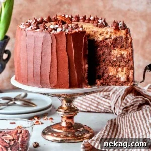 Cake server lifting slice of German chocolate cake from layered dessert.