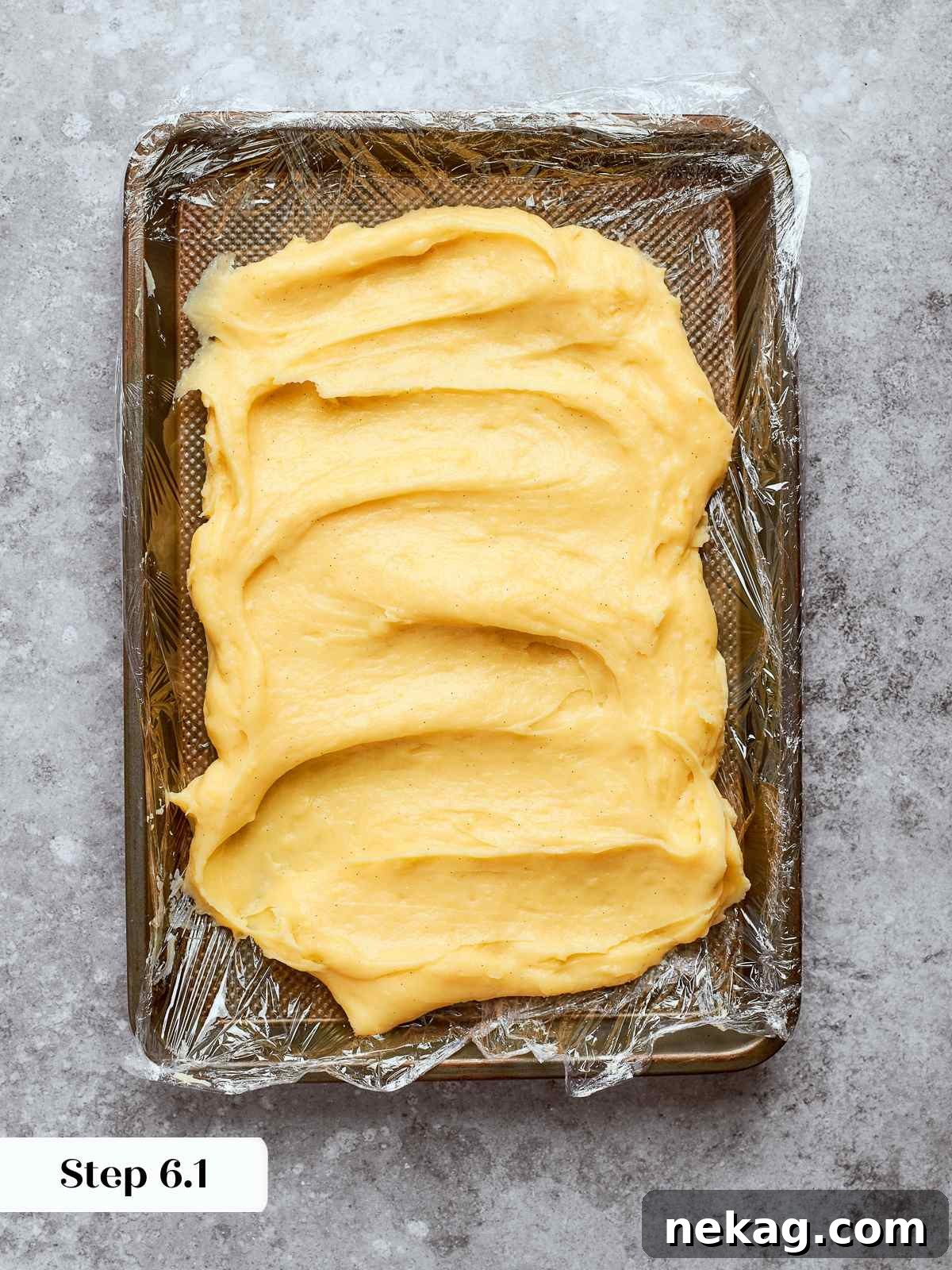 Sweet Puffs of Delight 13 Hot pastry cream spread on a lined sheet pan to cool quickly and evenly.