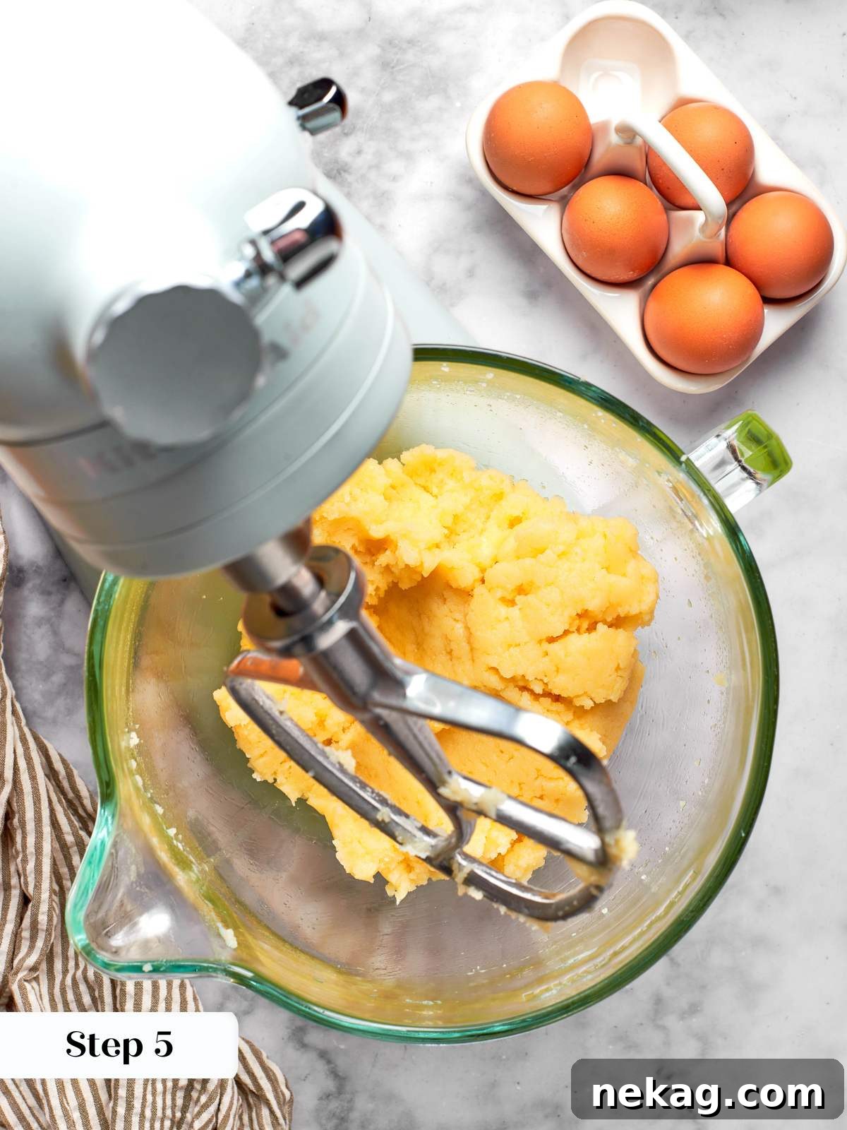Sweet Puffs of Delight 19 releasing steam from choux panade in mixer.