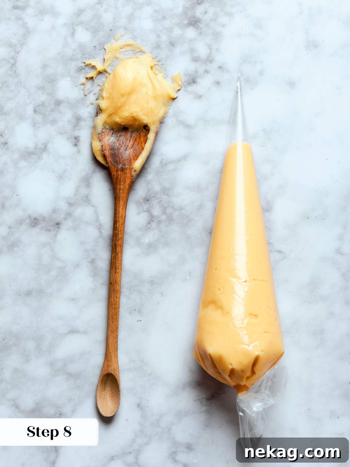 Sweet Puffs of Delight 22 choux paste in piping bag and on spoon on marble.