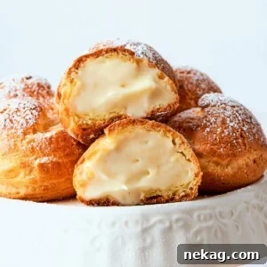 Sweet Puffs of Delight 36 Golden cream puffs filled with light crème légère arranged on a serving plate.