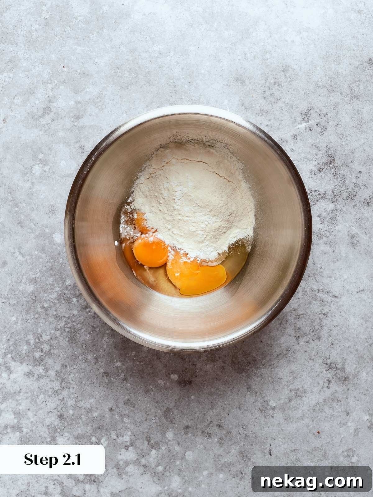 Sweet Puffs of Delight 8 Eggs and sugar being whisked together in a bowl to form the pastry cream base.