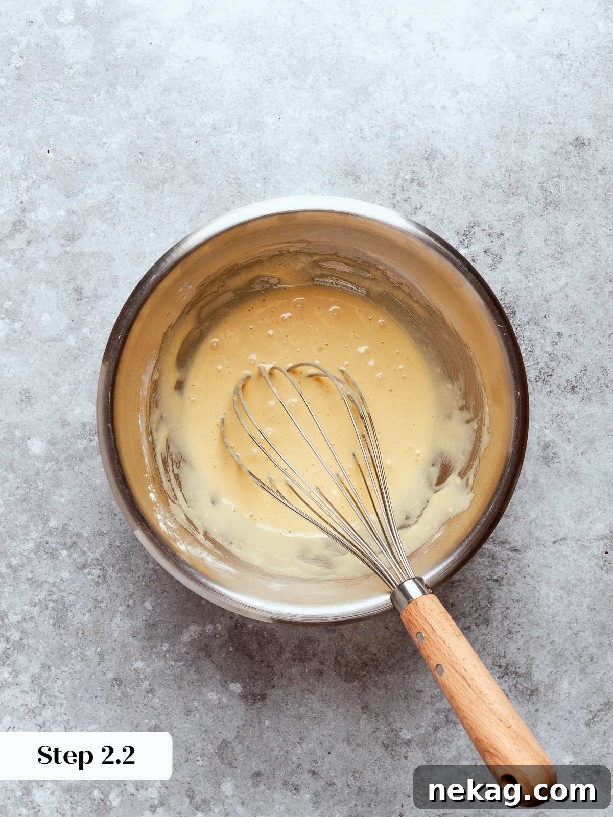 Sweet Puffs of Delight 9 Fully whisked egg and sugar mixture appearing smooth and slightly pale before cooking.