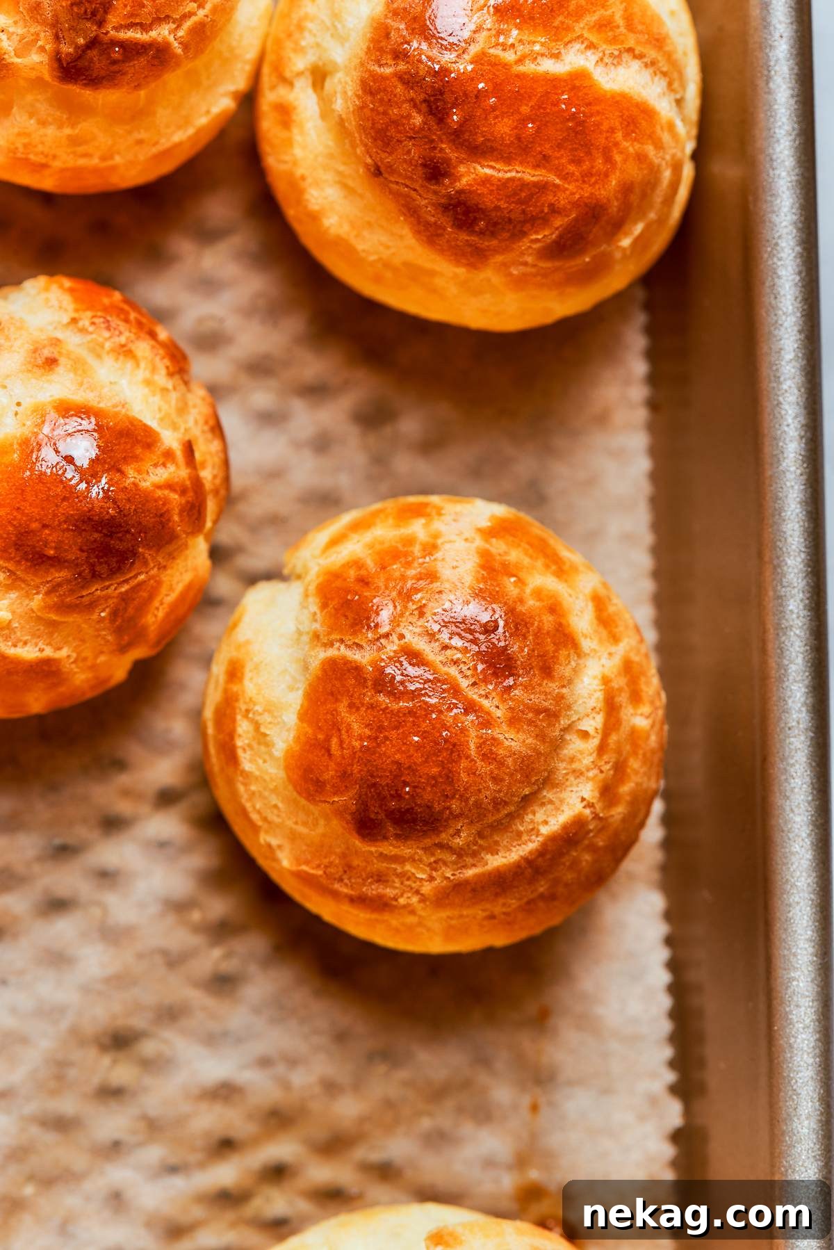 Golden choux pastry puff showing even browning and well developed crisp shell.
