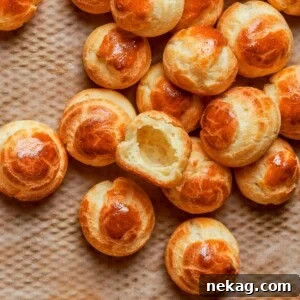 Baked choux pastry with deep golden color indicating crisp exterior and proper oven drying.