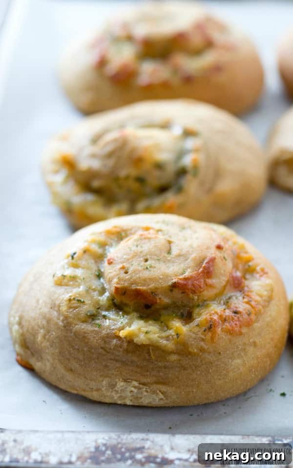 These soft dinner rolls are stuffed full of melty cheesy and lots of garlic flavor.---they're the perfect side-kick to a hot bowl of soup! 