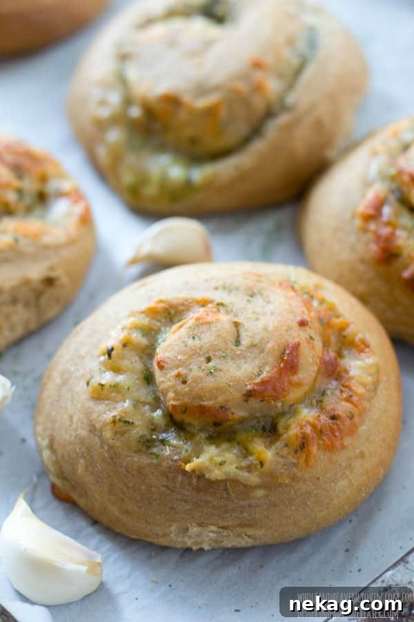 These soft dinner rolls are stuffed full of melty cheesy and lots of garlic flavor.---they're the perfect side-kick to a hot bowl of soup! 
