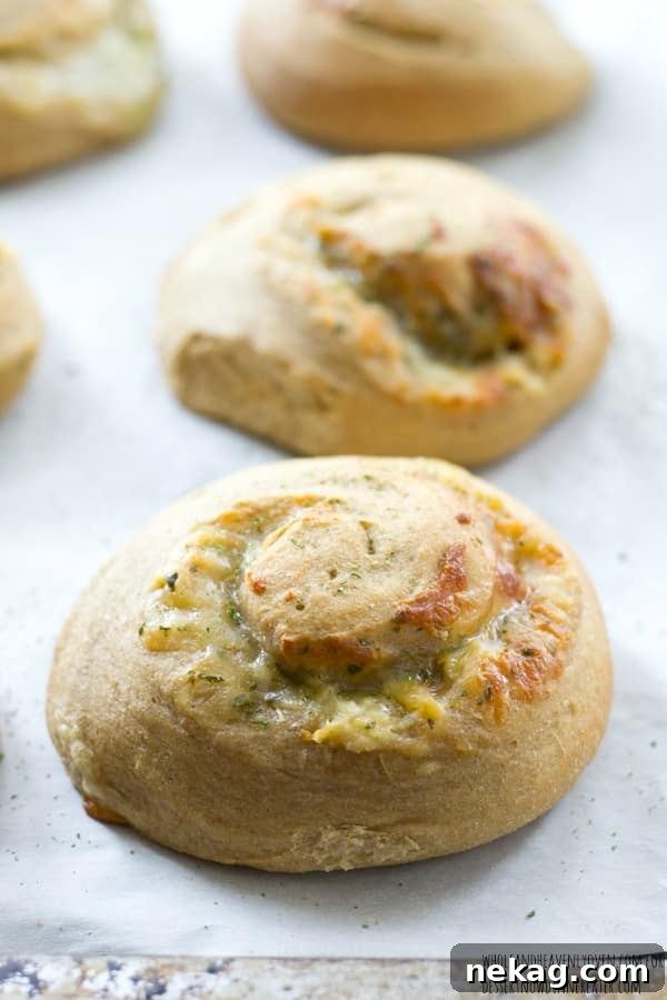 These soft dinner rolls are stuffed full of melty cheesy and lots of garlic flavor.---they're the perfect side-kick to a hot bowl of soup! 