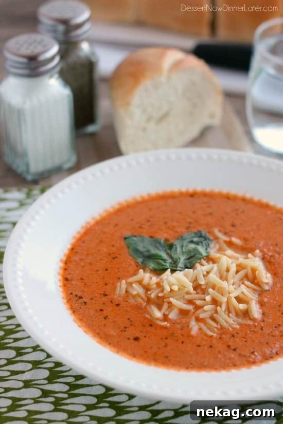 Zupas Tomato Basil Soup Recipe (Copycat) 3 Bowl of tomato basil soup garnished with pesto