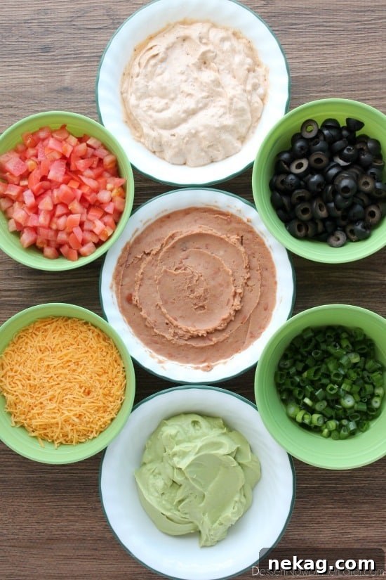 Classic Seven-Layer Dip Recipe for Parties and Game Day 4 Seven Layer Dip is a classic party snack or football food. This version has a secret ingredient to make it a dip that is sure to get gobbled up by your guests!