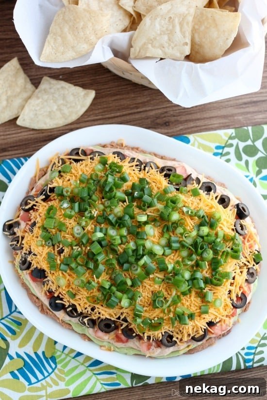 Classic Seven-Layer Dip Recipe for Parties and Game Day 5 Seven Layer Dip is a classic party snack or football food. This version has a secret ingredient to make it a dip that is sure to get gobbled up by your guests!