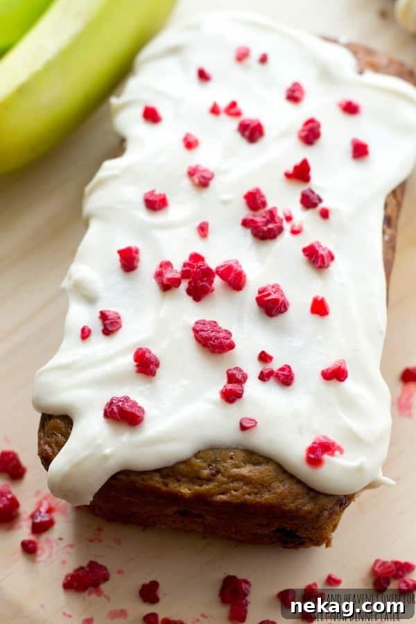 Berry Banana Bread with Cream Cheese Glaze 7 This super-soft and moist banana bread is exploding with a double-delight of juicy berries and perfectly covered in a tangy cream cheese icing. | dessertnowdinnerlater.com