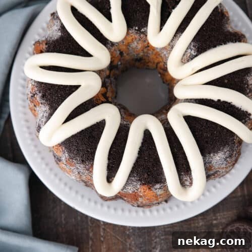 Top view of Cookies and Cream Monkey Bread on a plate with zig-zagged cream cheese frosting on top.
