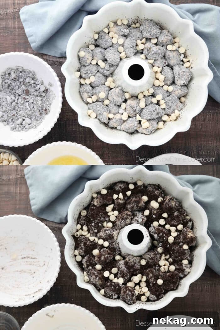 Layering Oreo pudding covered dough pieces into bundt pan with white chocolate chips and crushed cookies.