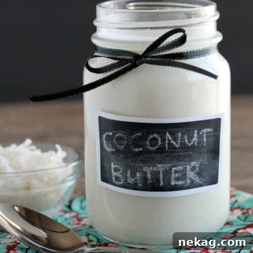 Homemade Coconut Butter is made by pureeing unsweetened shredded coconut into a liquid/paste.