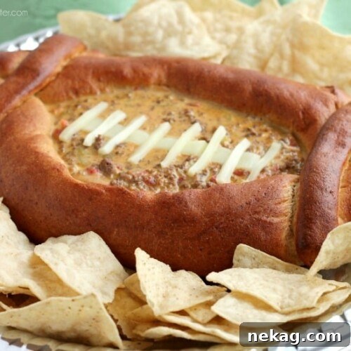 Game Day Football Dip Bowl Recipe and Serving Guide 5 This Football Dip Bowl is made with a frozen whole wheat dough that is shaped into a football with a place to hold your favorite queso dip! Make laces with cut up string cheese and you have a football themed party food! (Step-by-step photos included.)