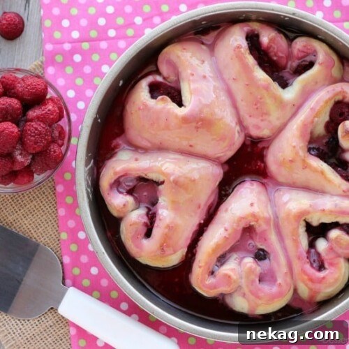 These heart shaped raspberry rolls are the perfect sweet treat or breakfast idea for your sweetheart this Valentine's Day!