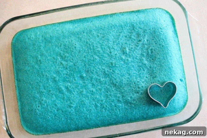 Gender Reveal Cupcake Ideas and Party Tips 6 These Gender Reveal Cupcakes have pink, blue, and white swirled frosting on top that hides the secret colored heart in the center of the cupcake revealing the baby's gender when you bite into it! (Step-by-Step Photo Tutorial)