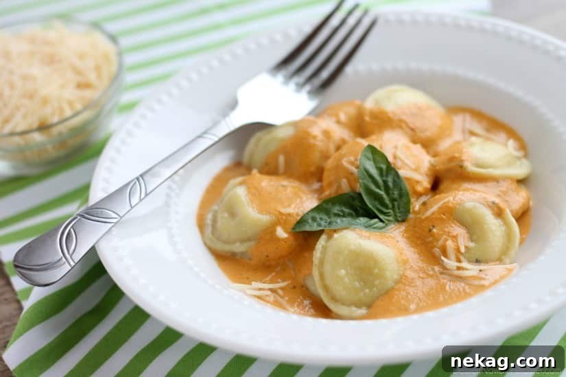 Roasted Red Pepper Ravioli - Fresh and creamy roasted red pepper sauce atop al dente cooked cheese filled ravioli, for a restaurant-quality Italian dish made easy at home!