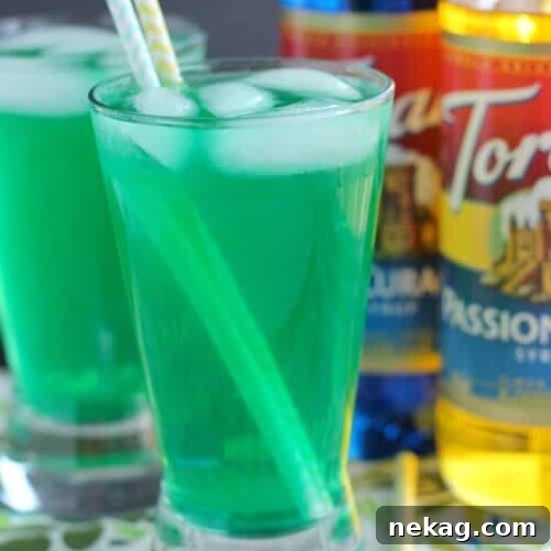 Xanadew - this FIIZ soda shop copycat drink recipe uses blue curacao and passion fruit syrups mixed into Mountain Dew for a fun green tropical mocktail!