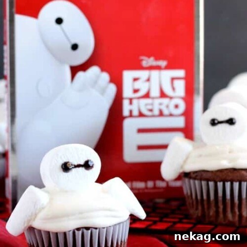Baymax Cupcakes: Big Hero 6-Themed Treats for Parties 15 Big Hero 6 comes to life at home with these Baymax Cupcakes topped with marshmallow frosting and large marshmallows. {Step-by-Step Tutorial}