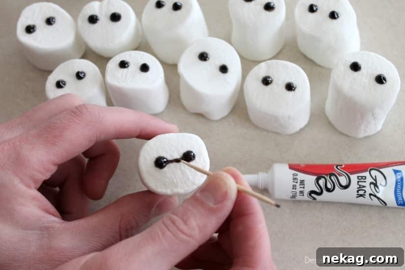 Baymax Cupcakes: Big Hero 6-Themed Treats for Parties 9 Baymax Cupcake Tutorial {Big Hero 6}