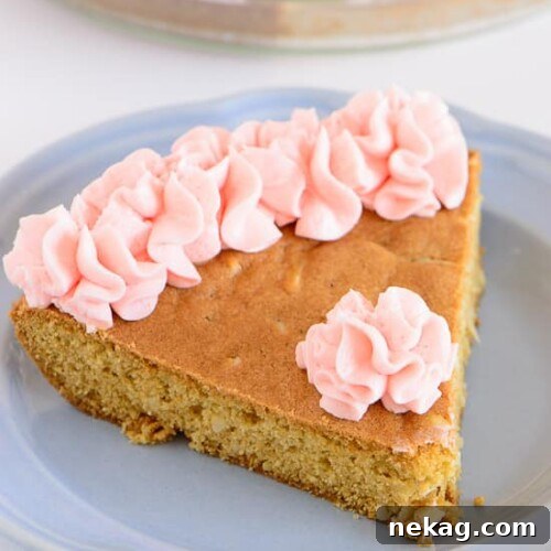 Almond Cherry Sugar Cookie Cake Recipe for Spring Gatherings 7 Almond Cherry Cookie Cake - Almond flavored sugar cookie cake with slivered almonds throughout and topped with cherry frosting. The best sugar cookie you will ever have!