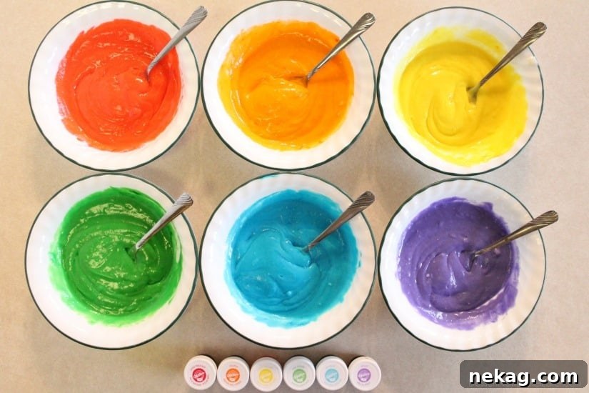 How to Make Colorful Rainbow Cupcakes (With Video Tutorial) 7 Bowls of rainbow cupcake batter