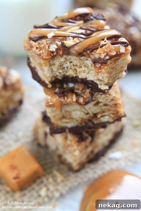 Samoa Oatmeal Cookie Bars  - These soft oatmeal cookie bars combine the beloved caramel, chocolate and coconut flavors of the Samoa Girl Scout cookies.