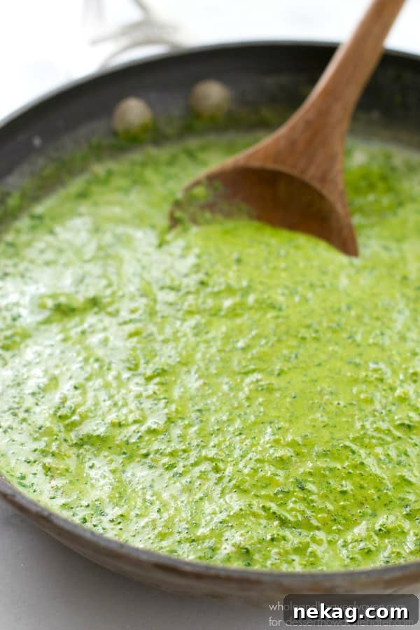 This creamy fettuccine combines the best worlds of both alfredo sauce and fresh pesto into one fresh springtime pasta side dish!