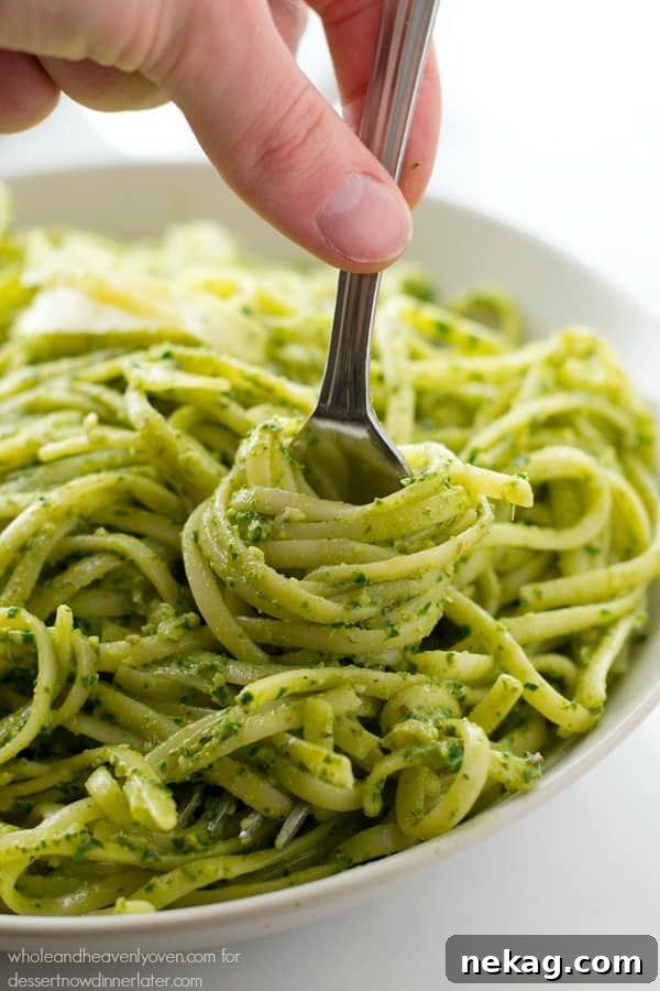 This creamy fettuccine combines the best worlds of both alfredo sauce and fresh pesto into one fresh springtime pasta side dish!