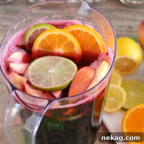 Easy Virgin Sangria - only 2 ingredients plus fresh cut fruit. A bubbly, fruity drink perfect for any party!