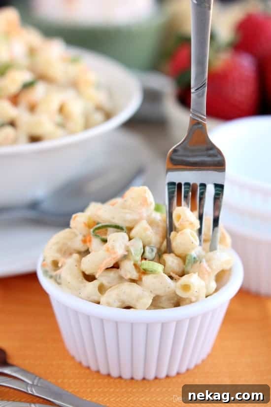 This Hawaiian-style macaroni salad is super creamy, lightly sweet, and truly the BEST macaroni salad out there! The perfect side dish for any party or potluck!
