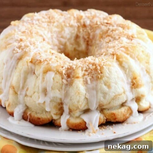 Pina Colada Monkey Bread - toasted coconut, crushed pineapple, and a secret ingredient combine together to make this sticky pull apart bread a tropical treat!