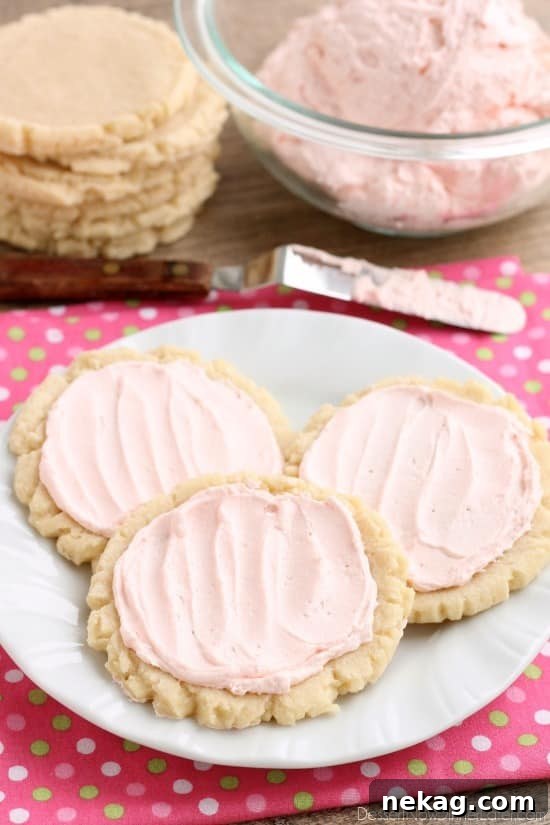 The ingredients list might surprise you with these scoop, press, and bake rustic-looking sugar cookies. With a soft, sweet, melt-in-your-mouth cookie base, topped with a smooth and dreamy buttercream frosting -- these really are the BEST sugar cookies you will make at home!