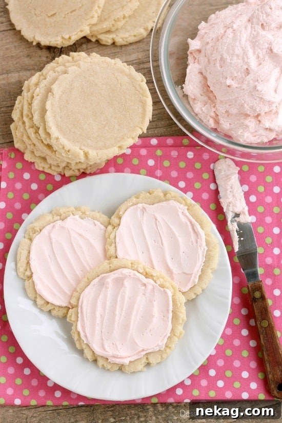 The ingredients list might surprise you with these scoop, press, and bake rustic-looking sugar cookies. With a soft, sweet, melt-in-your-mouth cookie base, topped with a smooth and dreamy buttercream frosting -- these really are the BEST sugar cookies you will make at home!