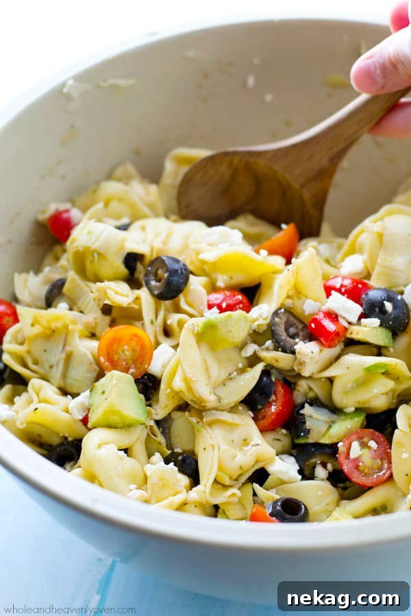 Bring this super-fresh tortellini salad to any picnic and watch it disappear! Loaded with a rainbow of Mediterranean ingredients and tossed in a tangy citrus balsamic dressing.