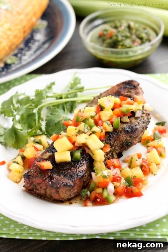 This restaurant-quality steak is marinated in an herbed chimichurri sauce, grilled to perfection, and topped with a spicy-sweet pineapple salsa.