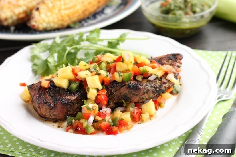 Chimichurri marinated steak topped with pineapple salsa