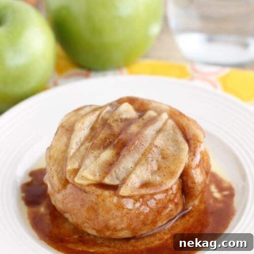 This single serving Upside-Down Apple Cinnamon Roll cooks in 2 minutes in the microwave! The perfect fall dessert for one!