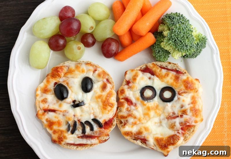 Mini Mummy Pizza Bites: Spooky Halloween Appetizer Recipe 9 Mini Mummy Pizzas are a fun and easy food the kids can make for Halloween!