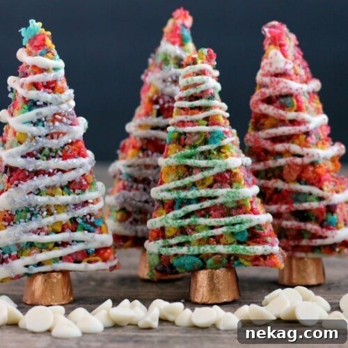 Fruity Pebbles cereal lights up these festive Krispie Treat Christmas Trees that are easy and fun to make for the holidays!