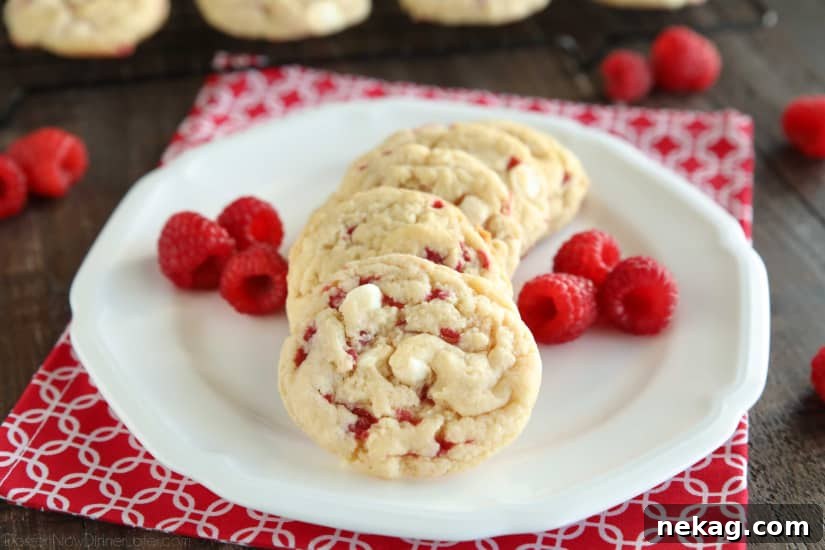 Raspberry Cheesecake Cookies are soft, chewy, and fruity! The best part is that they are made with a muffin mix which makes it a super easy dessert!