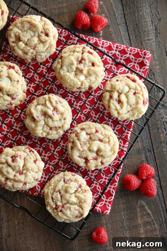 Raspberry Cheesecake Cookies are soft, chewy, and fruity! The best part is that they are made with a muffin mix which makes it a super easy dessert!
