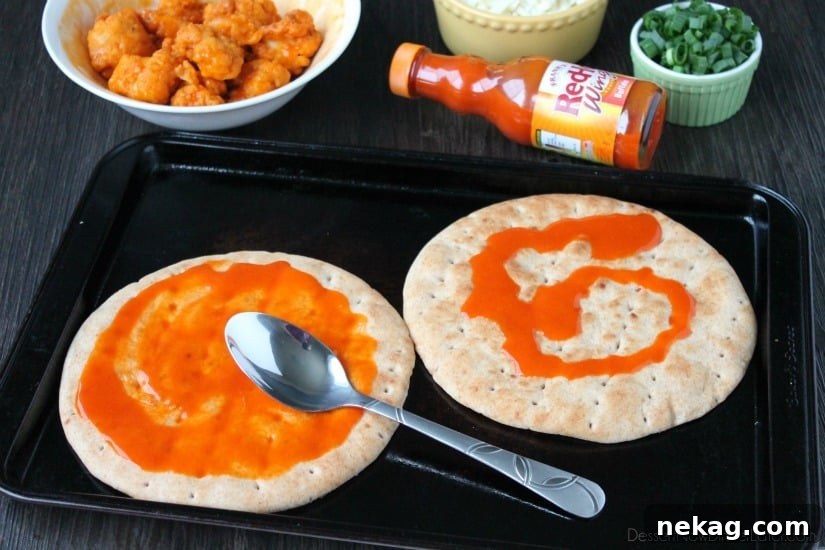 Farm Rich Boneless Buffalo Chicken Bites help make this flatbread pizza a quick and delicious game day snack!